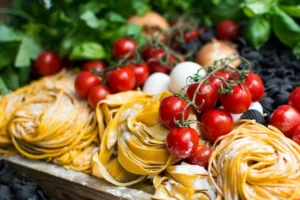 Different types of pasta with cheese and cherry tomatoes