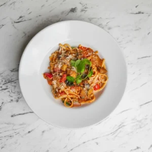 A white plate full of spaghetti