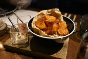 Potato wedges in the bowl with two dips on the side
