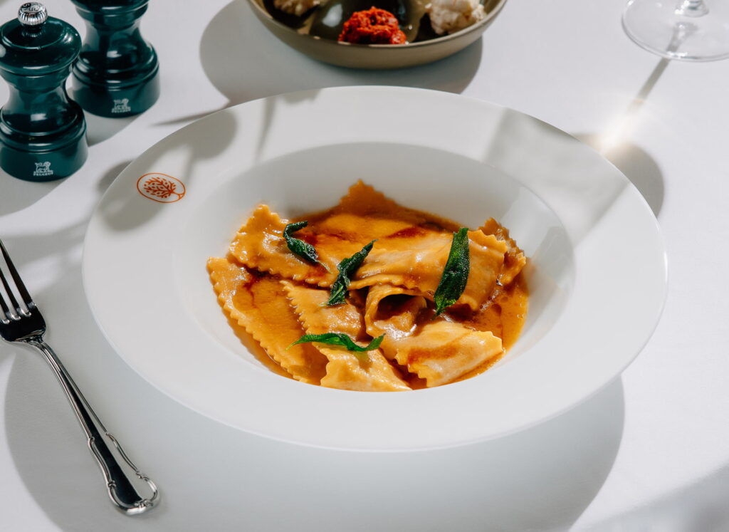 Ravioli in butter sage sauce with crispy leaves