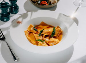 Ravioli in butter sage sauce with crispy leaves