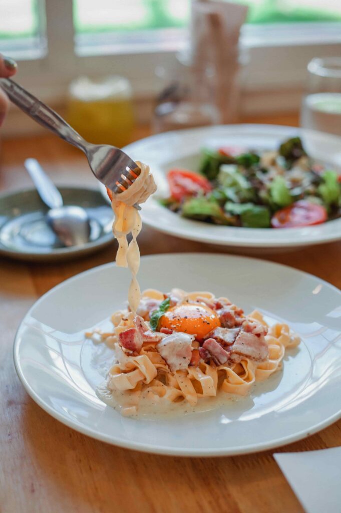 Fork wrapped with spaghetti in restaurant