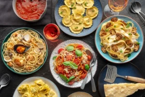 Handcrafted Italian pasta dishes served at MamaBella, featuring fresh ravioli, spaghetti, and classic sauces in an elegant dining setting