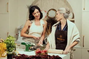 Young and Old lady preparing food at Mama Bella