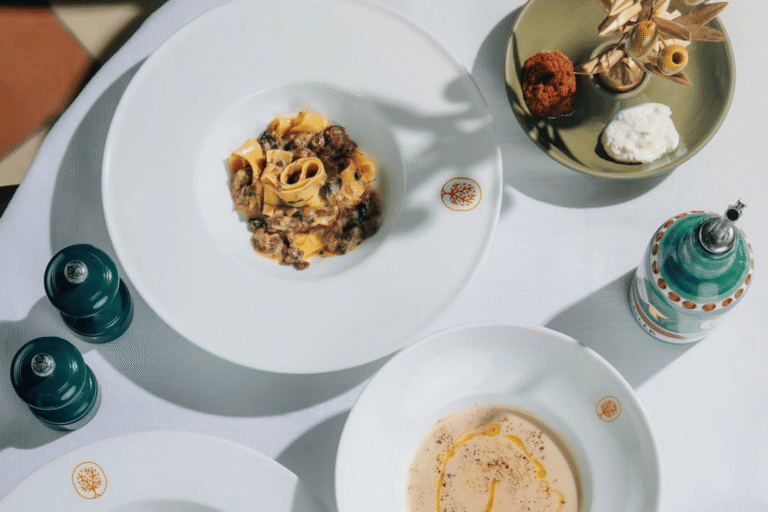 Mamabella dining spread featuring fresh pasta, creamy soup and Italian antipasti.