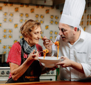Nonna and chef Alessandro Miceli sharing a bowl of spaghetti at Mamabella