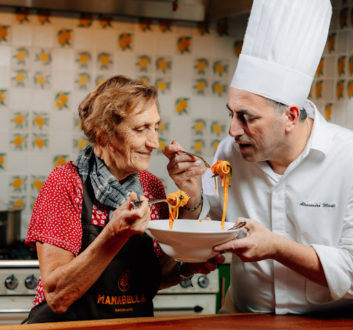 Nonna and chef Alessandro Miceli sharing a bowl of spaghetti at Mamabella