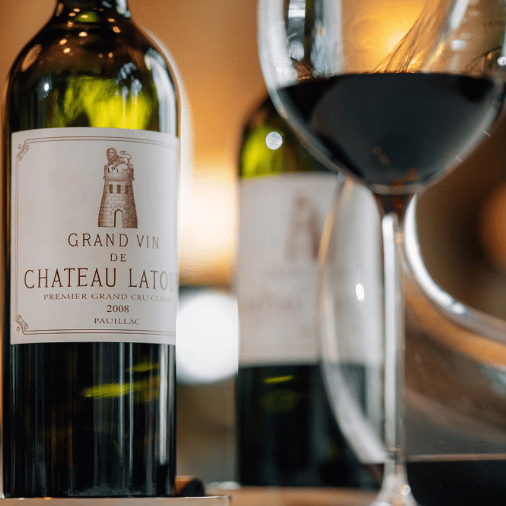 Château Latour red wine served at Mamabella, featuring a bottle and a glass of fine wine.